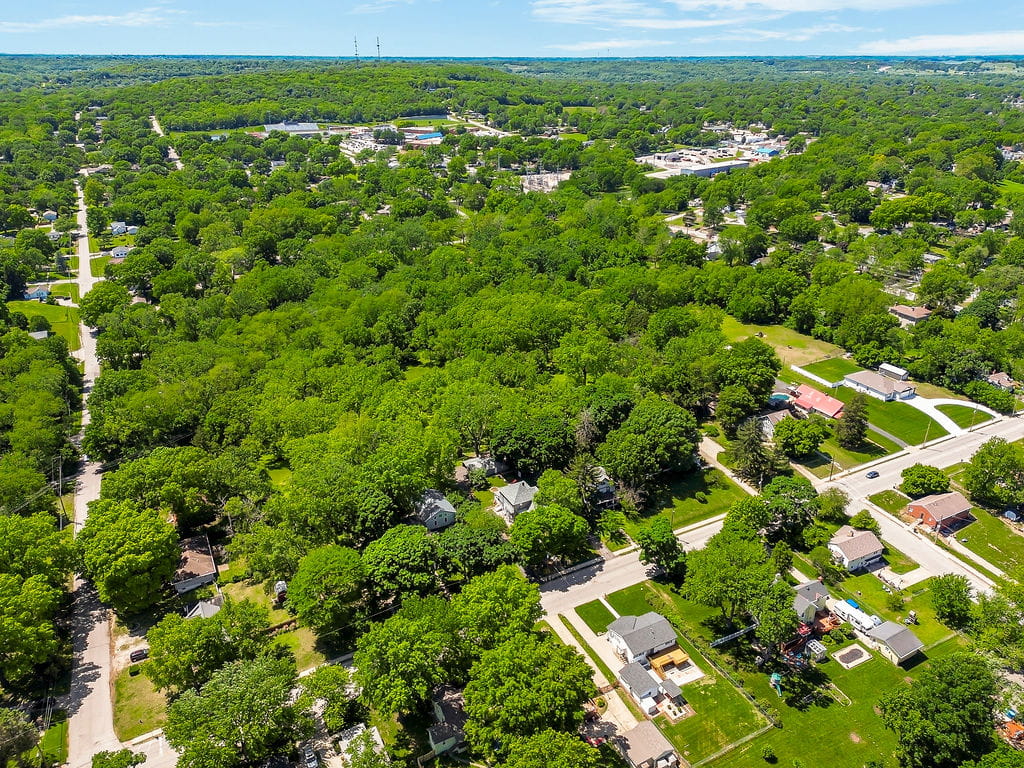 Aerial view of Leavenworth Kansas established neighborhoods — mature trees and affordable homes minutes from Fort Leavenworth
